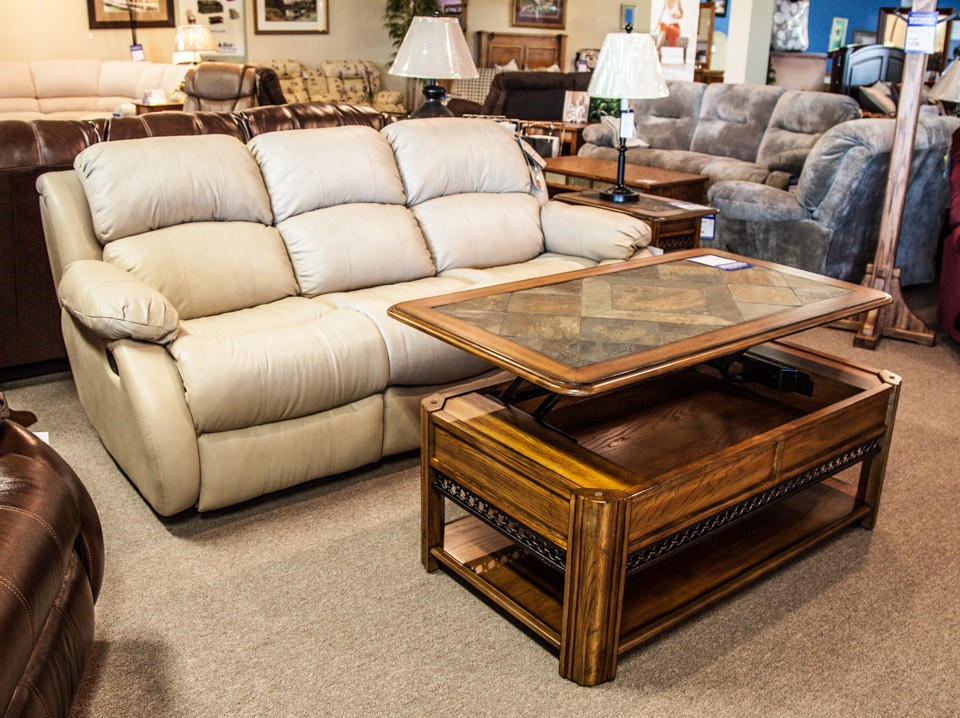 Off white leather reclining sofa with coffee table with a raisable top