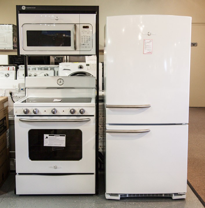 White matching kitchen refrigerator, microwave and oven