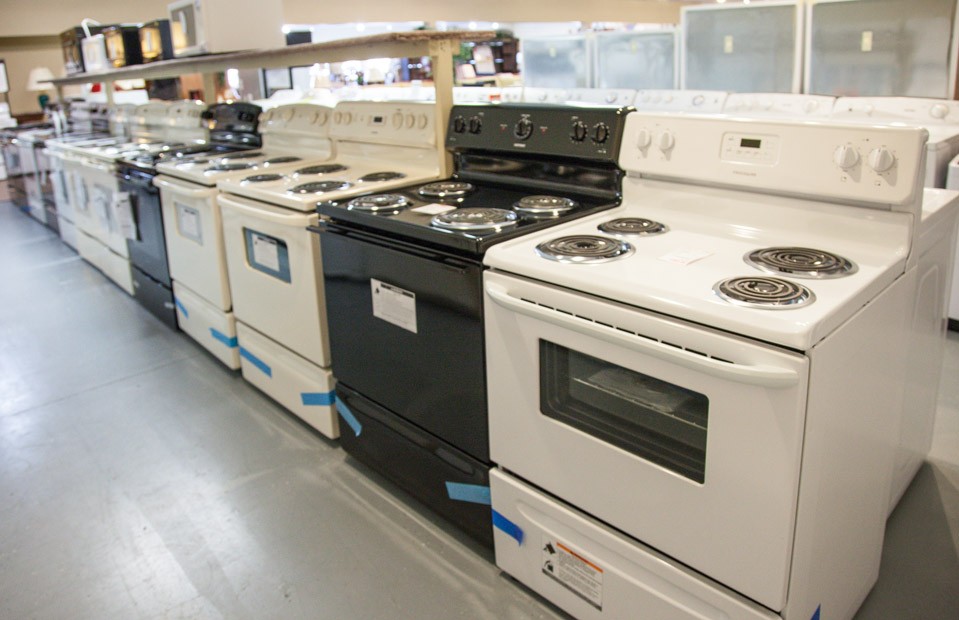 Row of kitchen stoves in showroom
