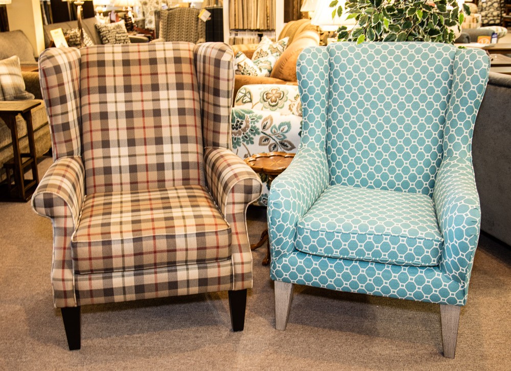 Two wingback chairs with patterned fabrics