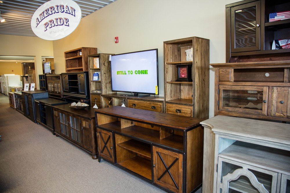 Several wood entertainment centers and book cases