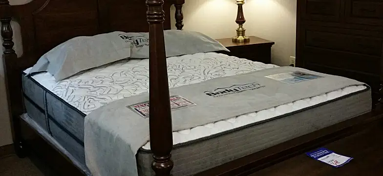 Mattress displayed on post bed